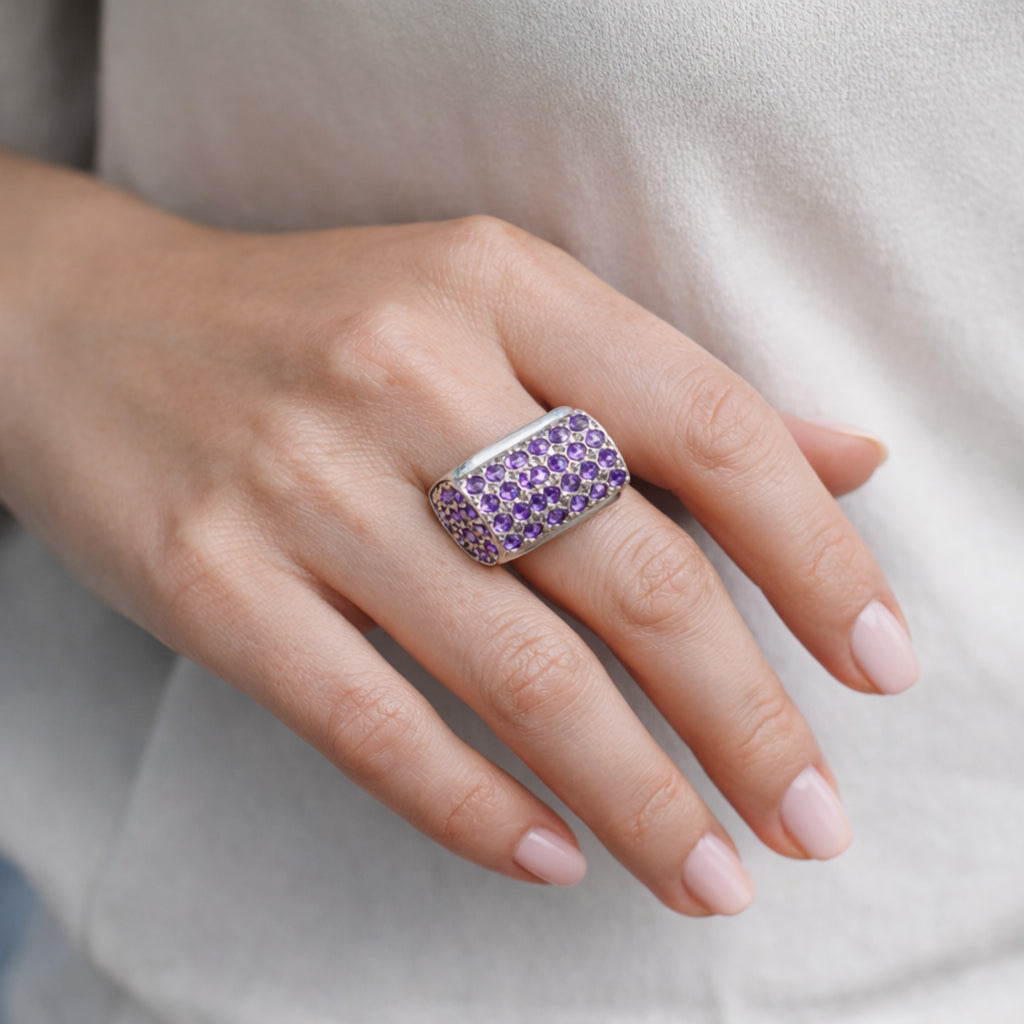 SILVER RING SET IN SMALL AMETHYSTS