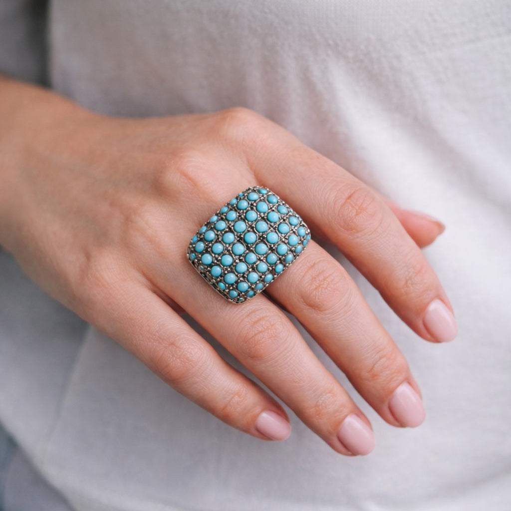 SILVER RING SET IN SMALL TURQUOISES