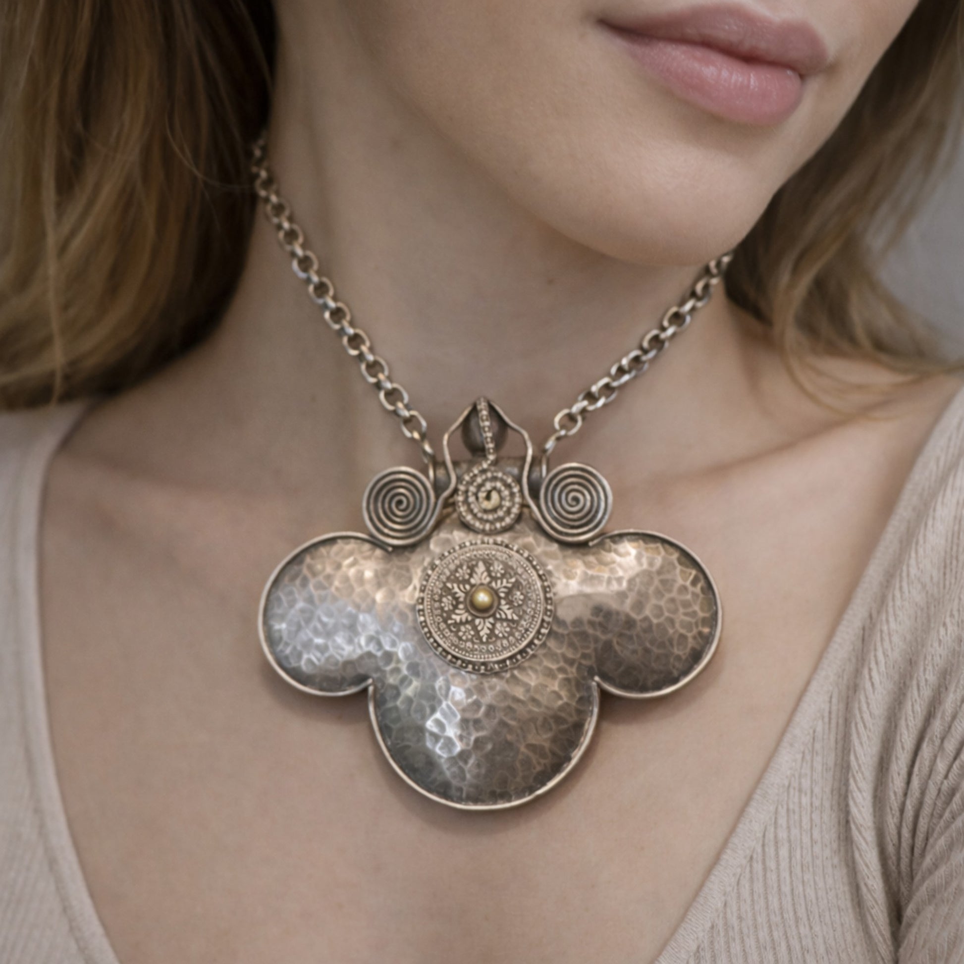 HANDCRAFTED SILVER PENDANT WITH A HAMMERED TEXTURE