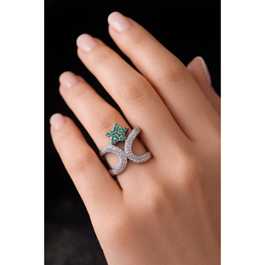 SILVER RING WITH ZIRCON STUDDED CURVES AND A GREEN GEMSTONE