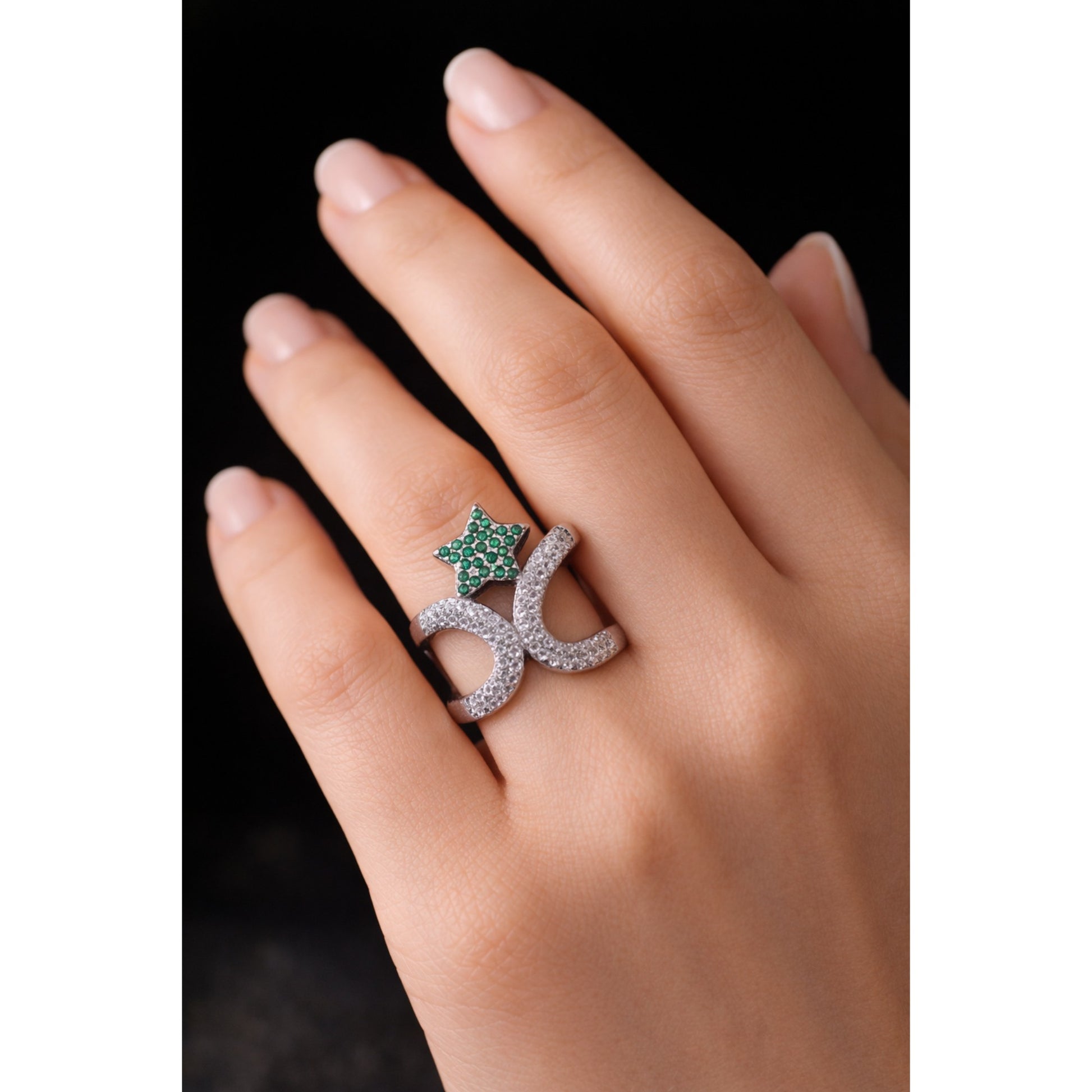 SILVER RING WITH ZIRCON STUDDED CURVES AND A GREEN GEMSTONE