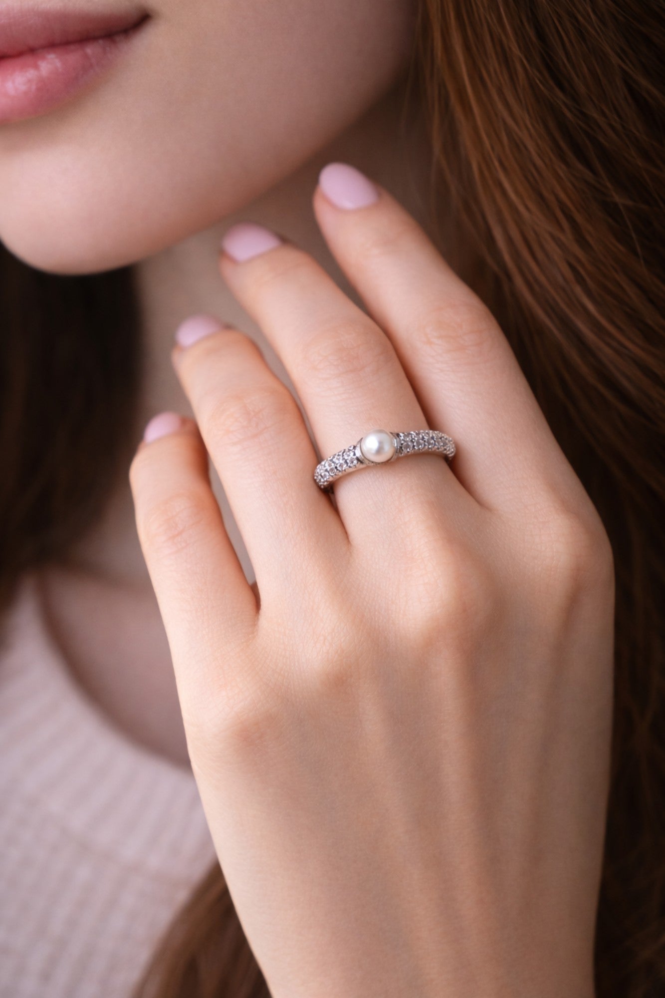 SILVER RING WITH A PEARL CENTER AND A ZIRCON STUDDED BAND