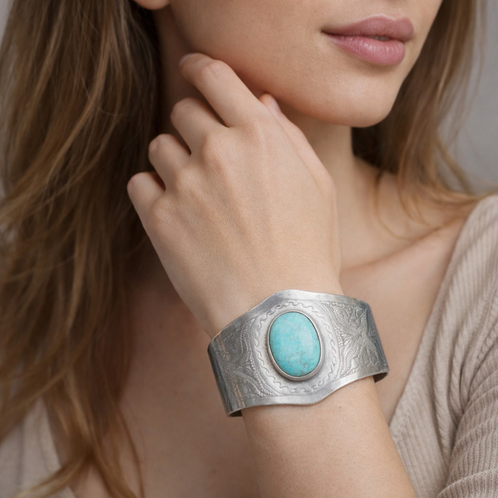 SILVER KADA FEATURING A ROUND TURQUOISE