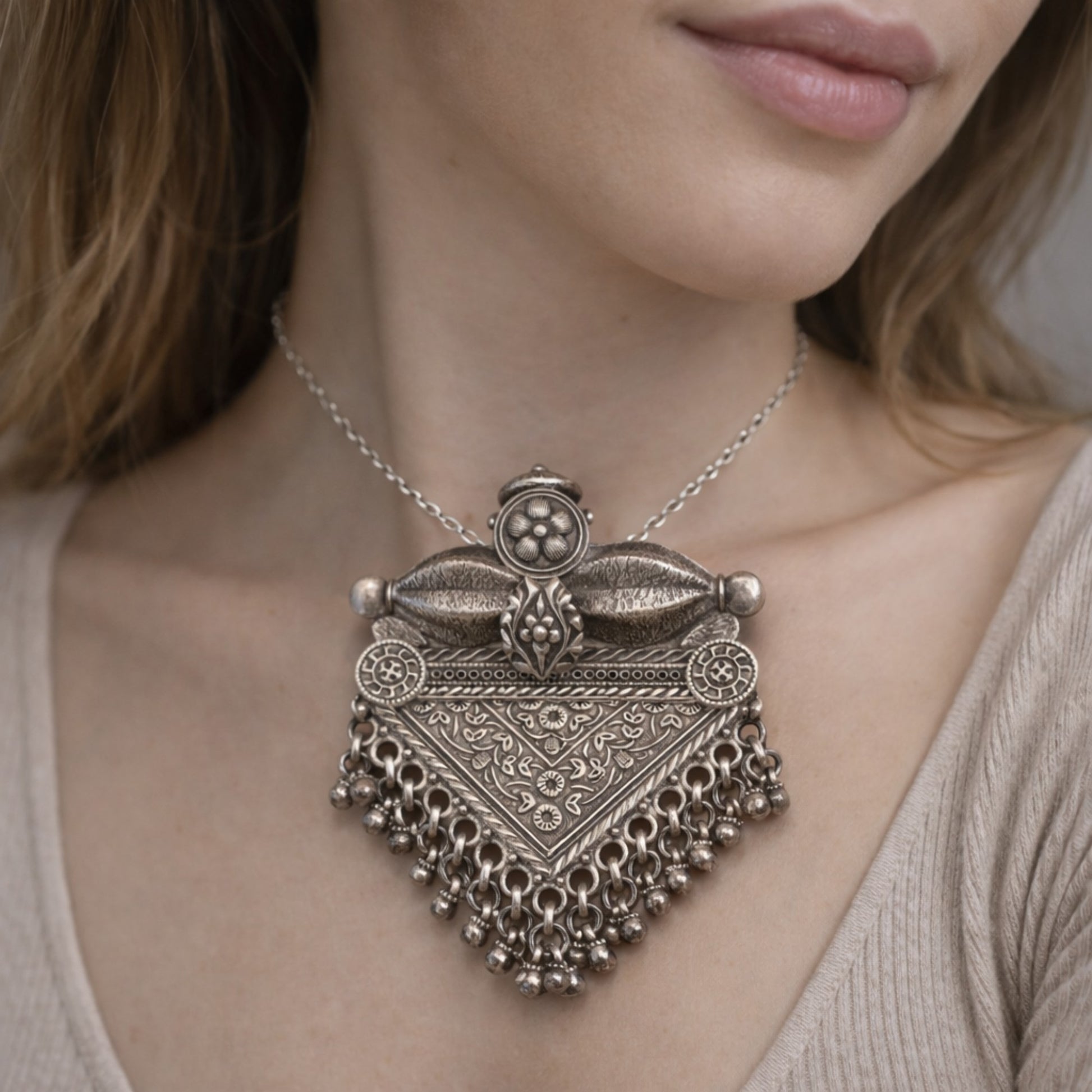 SILVER PENDANT WITH FLORAL CRAVINGS AND HANGING BEADS