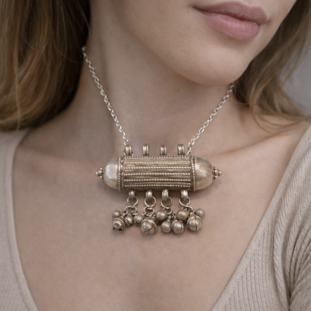 ANTIQUE CYLINDRICAL SILVER AMULET WITH GHUNGROO STYLE BALLS