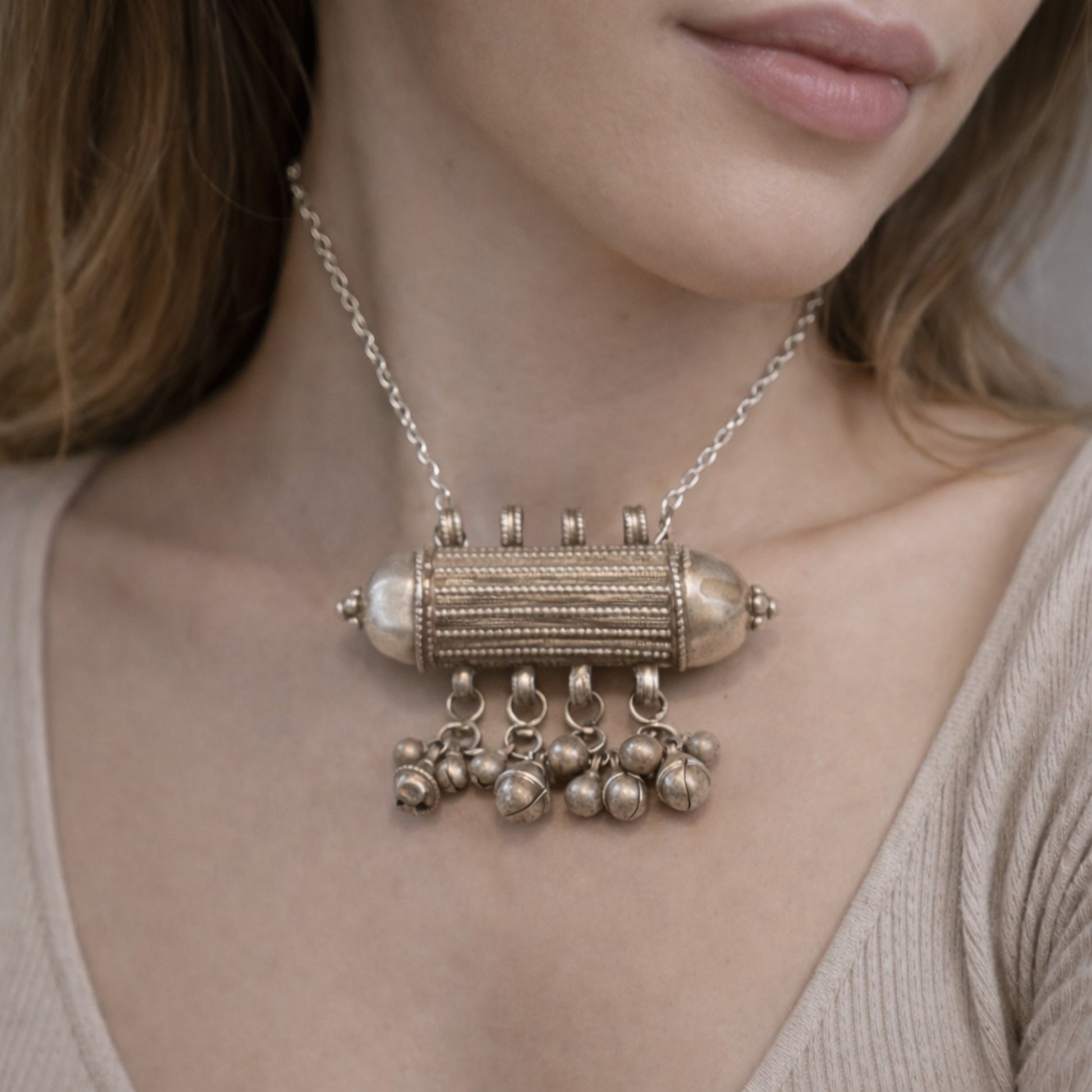 ANTIQUE CYLINDRICAL SILVER AMULET WITH GHUNGROO STYLE BALLS