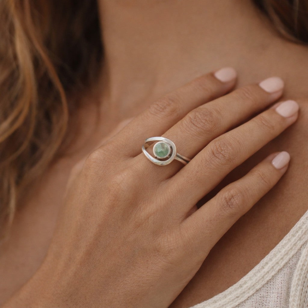 SILVER RING STUDDED WITH ETHIOPIAN OPAL