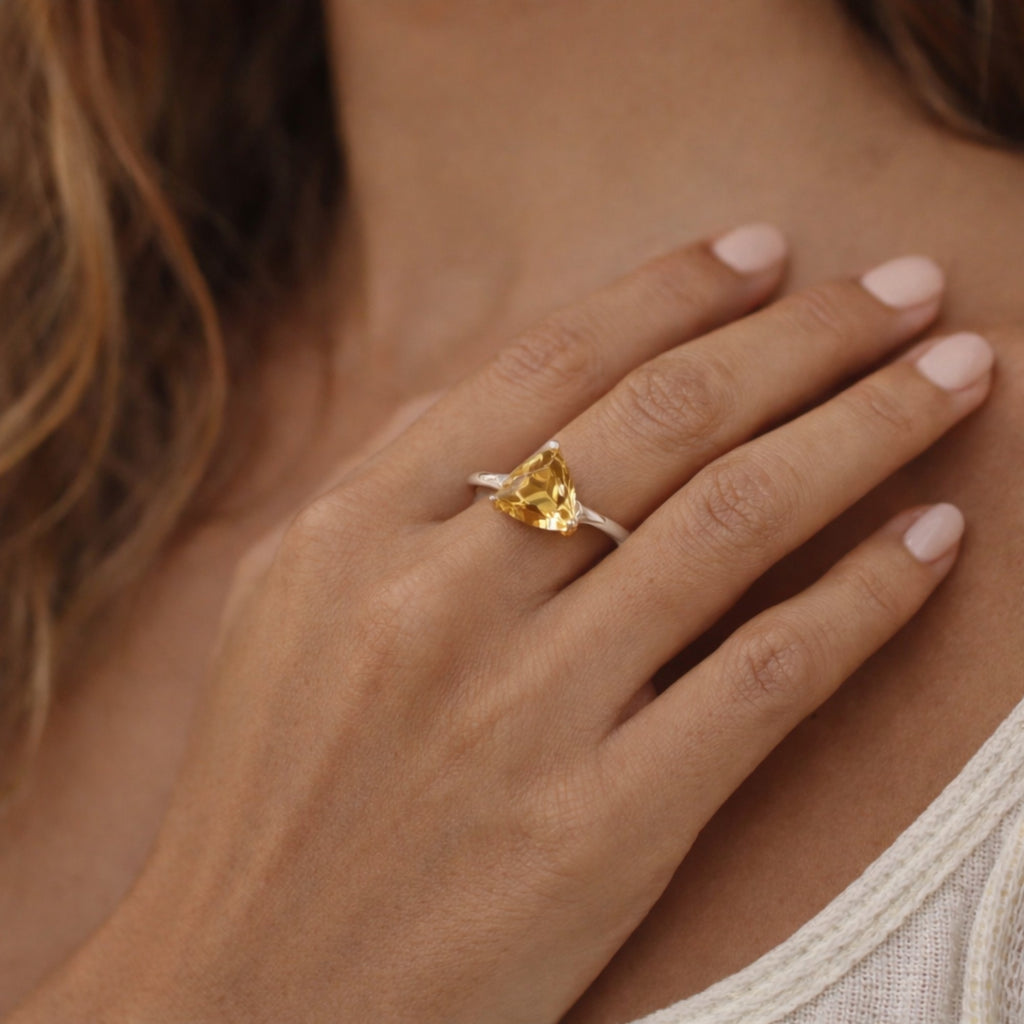 SILVER RING WITH A TRIANGULAR GOLDEN TOPAZ