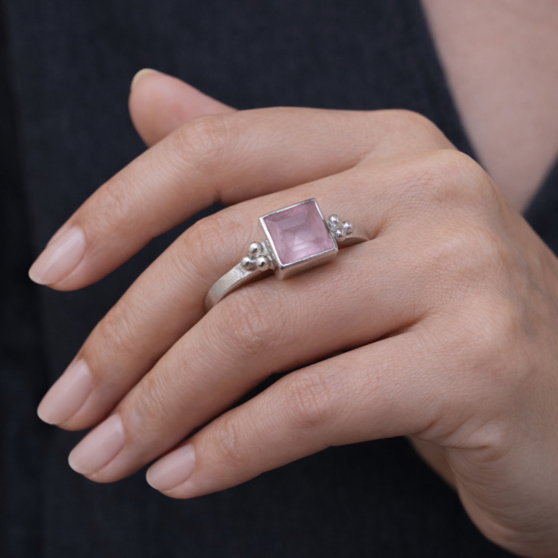 SILVER RING ADORNED WITH A BOLD SQUARE CUT PINK GEMSTONE