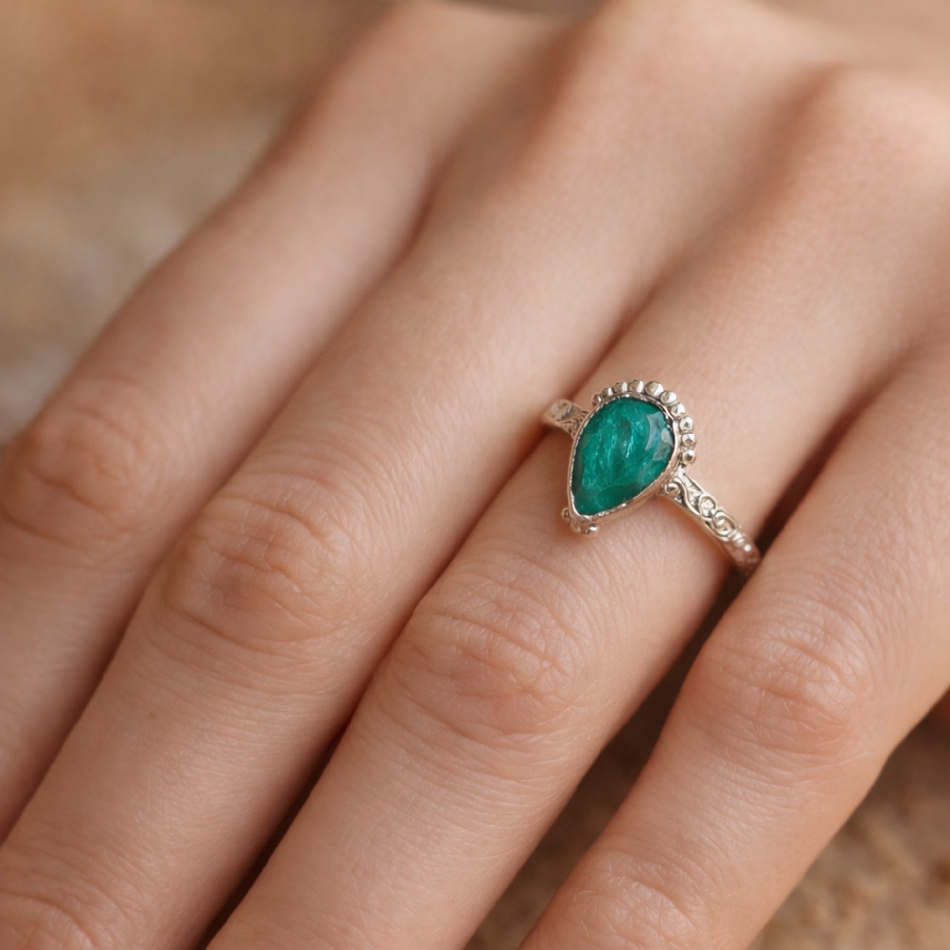 SILVER RING STUDDED WITH TEARDROP INDIAN EMERALD