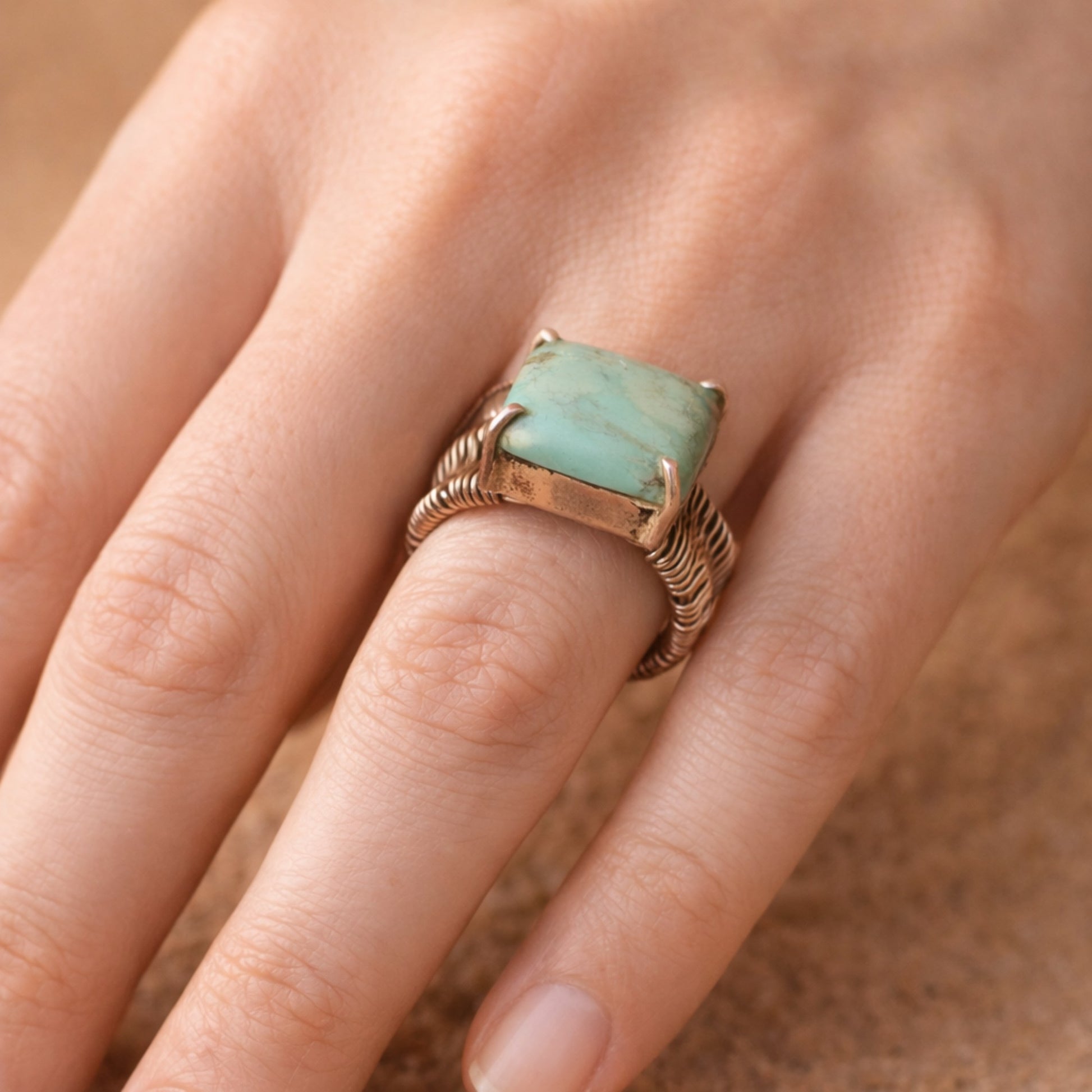 SILVER WIRE WRAPPED RING FEATURING A TURQUOISE