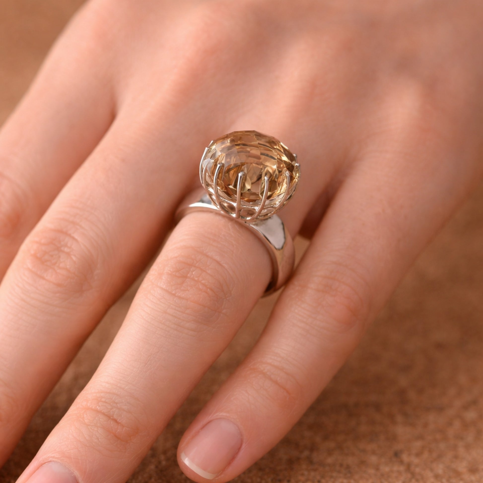 SILVER RING FEATURING A LARGE GOLDEN TOPAZ