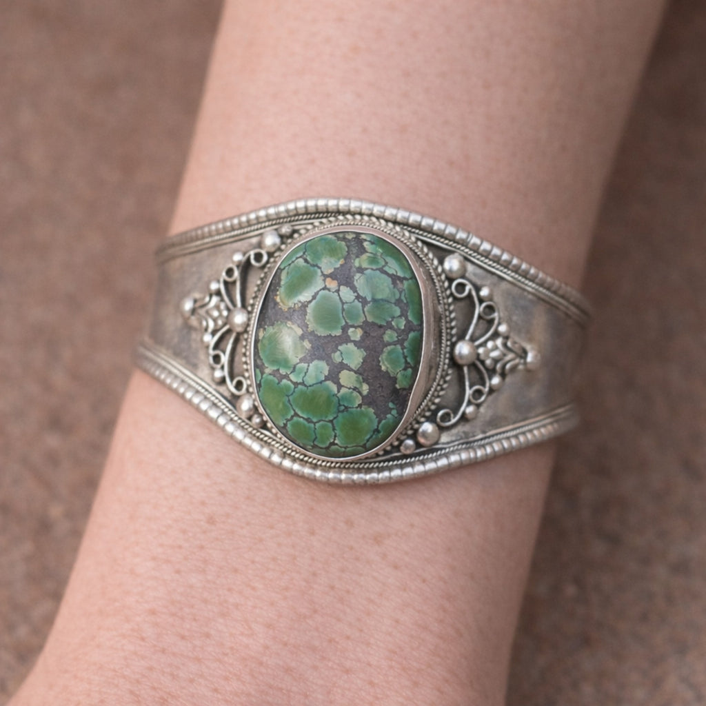 SILVER KADA FEATURING A LARGE TURQUOISE