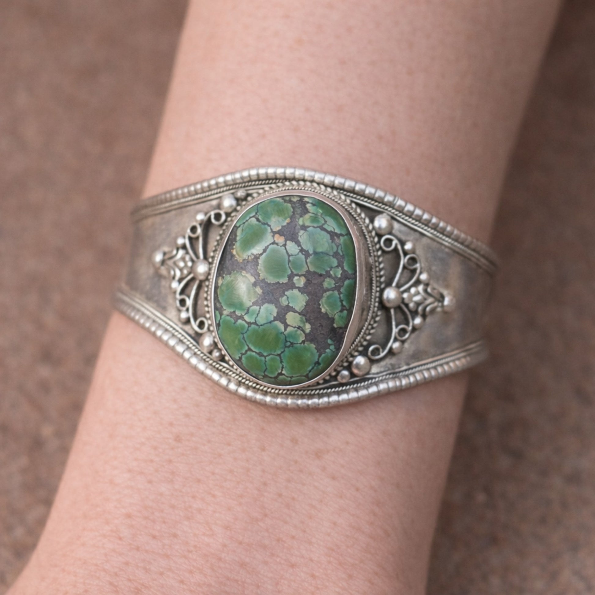 SILVER KADA FEATURING A LARGE TURQUOISE