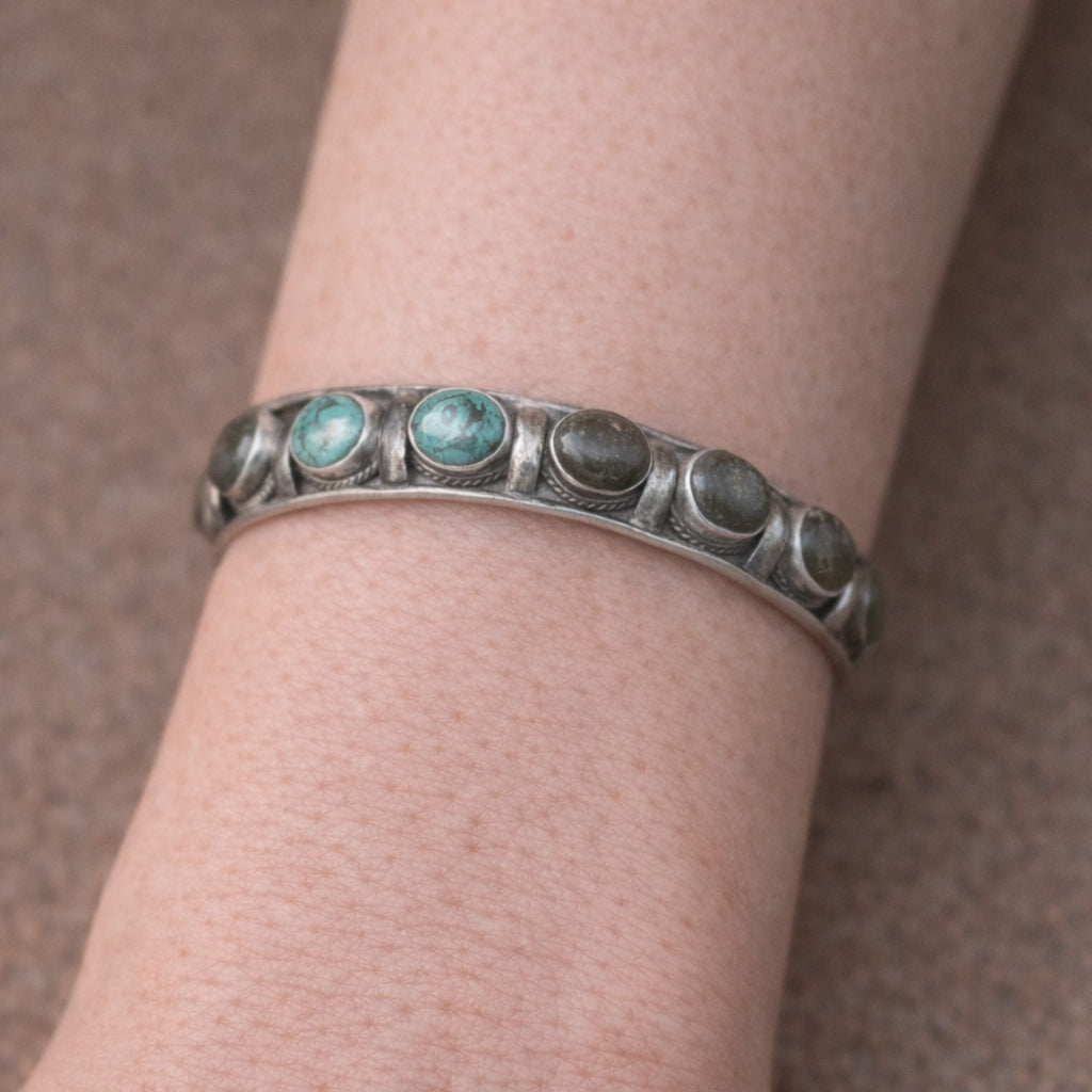 SILVER KADA FEATURING OVAL TURQUOISES AND GREEN GEMSTONES