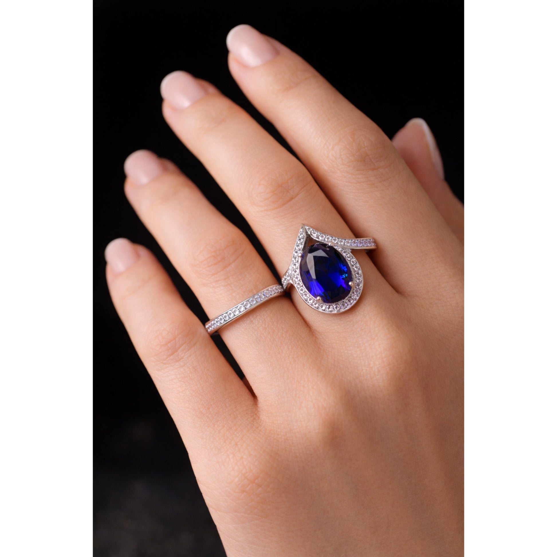 SILVER RING WITH TEARDROP HALO AND BLUE STONE