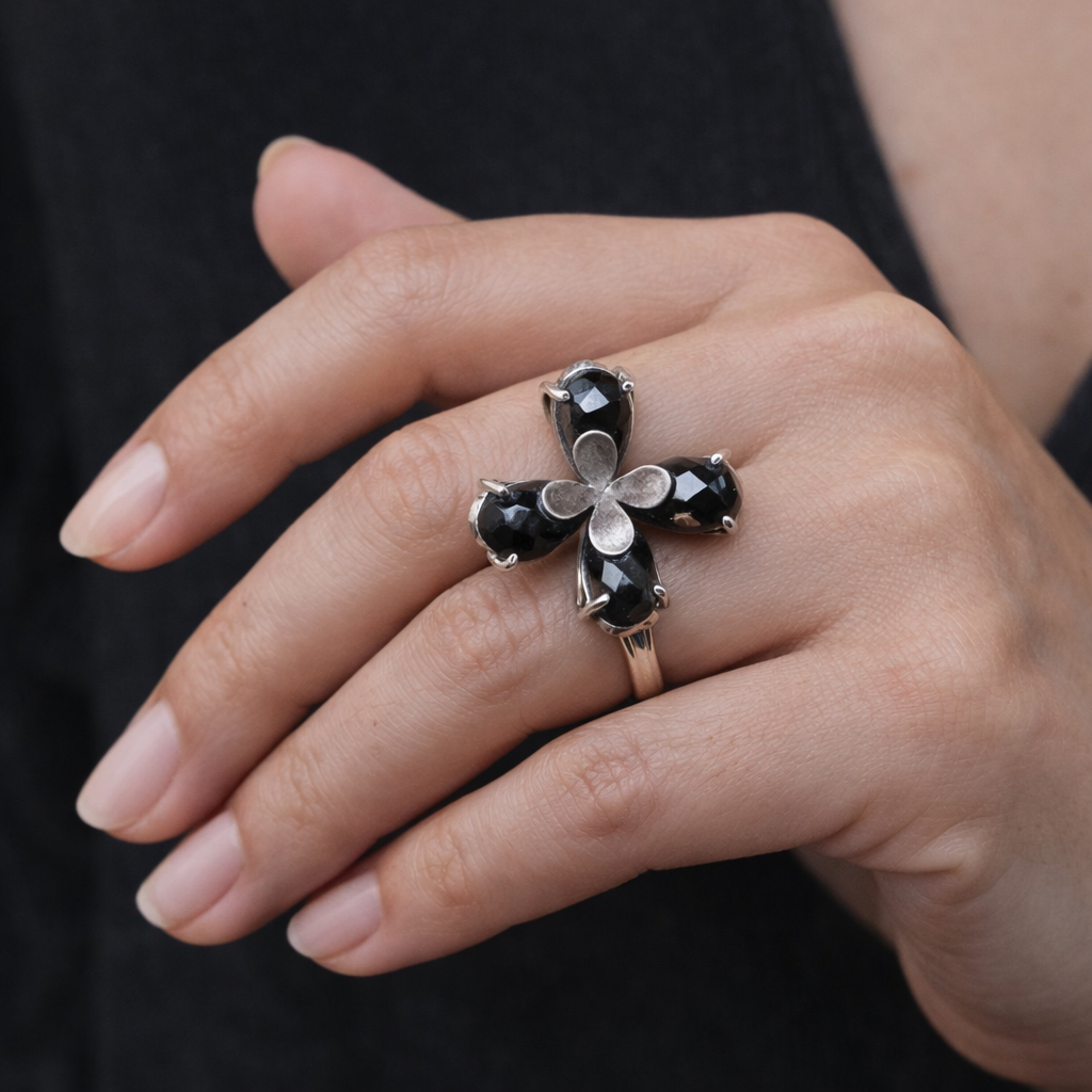 SILVER RING FEATURING SMOKY TOPAZ STONES ARRANGED IN A FLORAL PATTERN