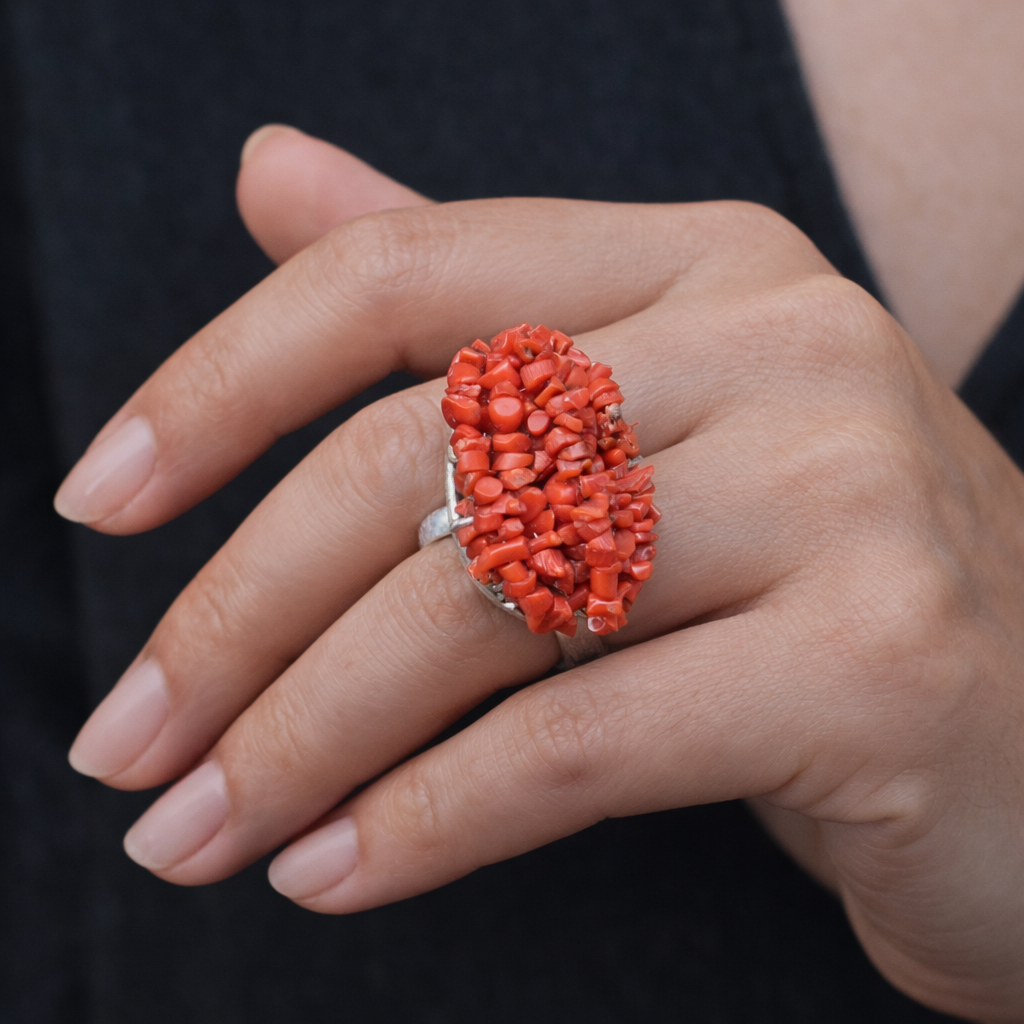 CHUNKY SILVER RING ADORNED WITH A CLUSTERED RED CORAL BEEDS