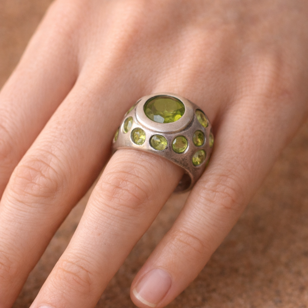 SILVER RING FEATURING MULTIPLE PERIDOTS