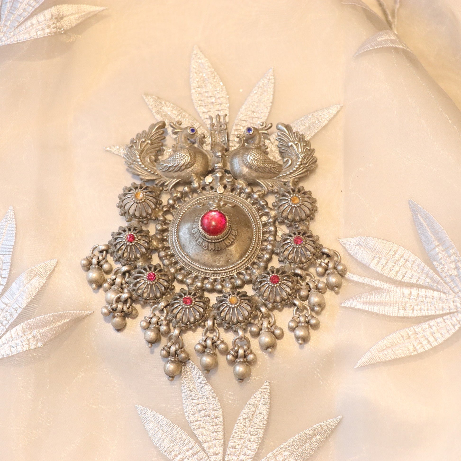SILVER PENDANT WITH TWIN PEACOCK FIGURES