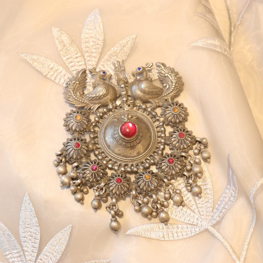 SILVER PENDANT WITH TWIN PEACOCK FIGURES