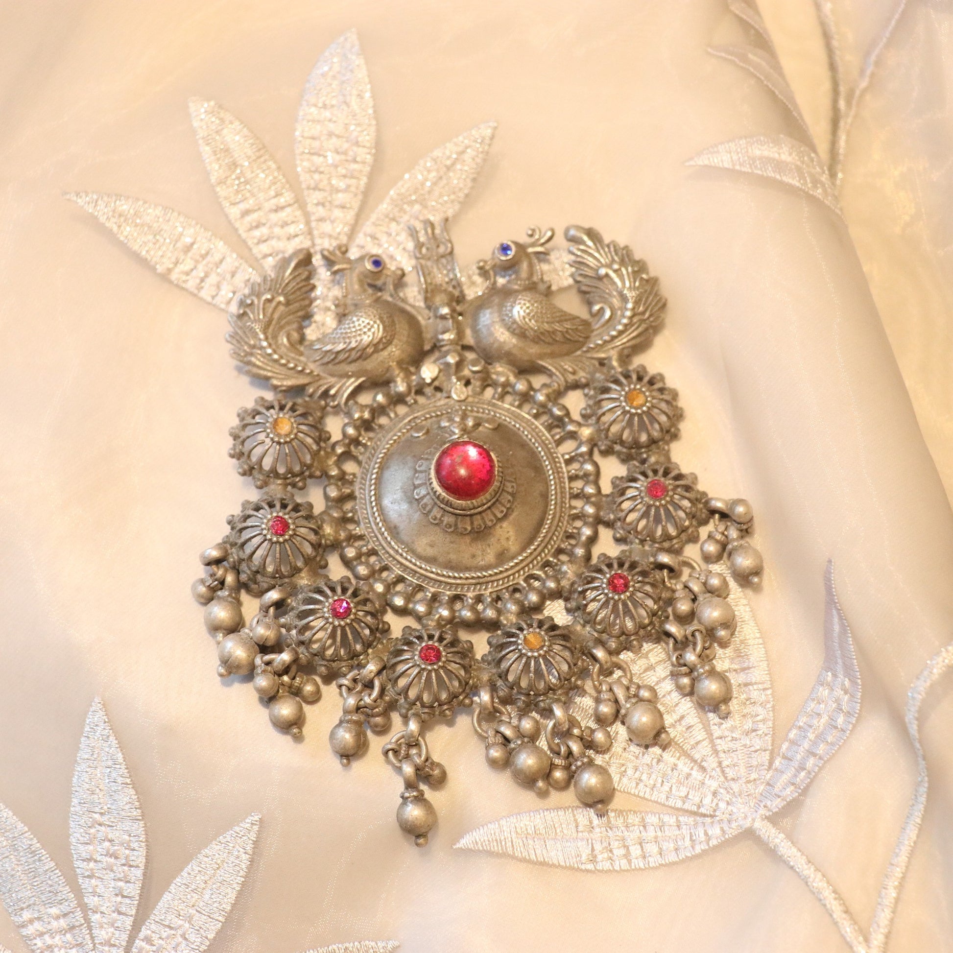 SILVER PENDANT WITH TWIN PEACOCK FIGURES