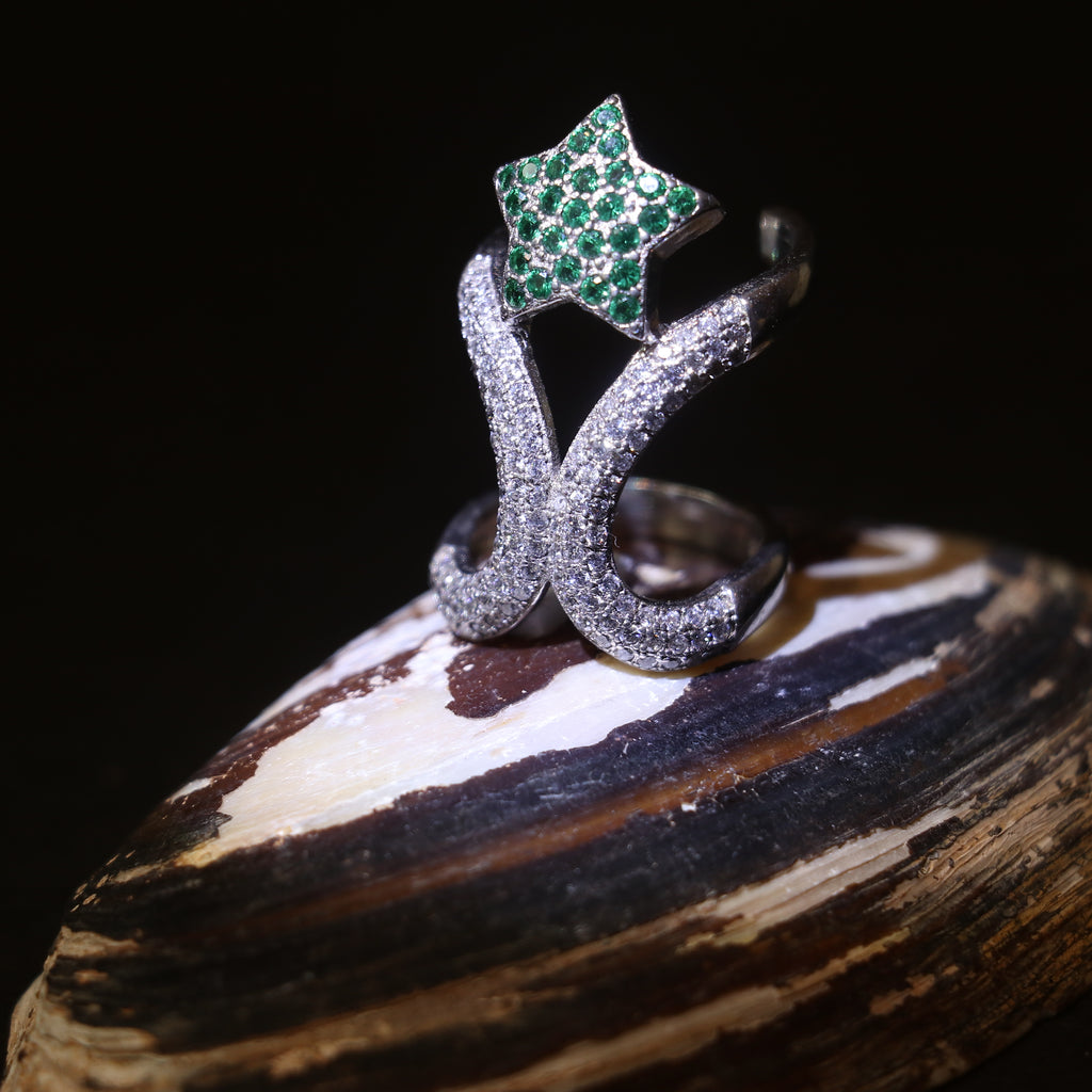 SILVER RING WITH ZIRCON STUDDED CURVES AND A GREEN GEMSTONE