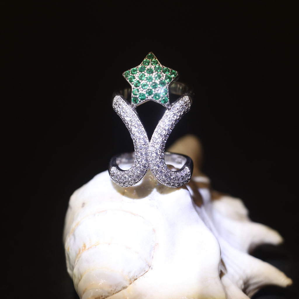 SILVER RING WITH ZIRCON STUDDED CURVES AND A GREEN GEMSTONE