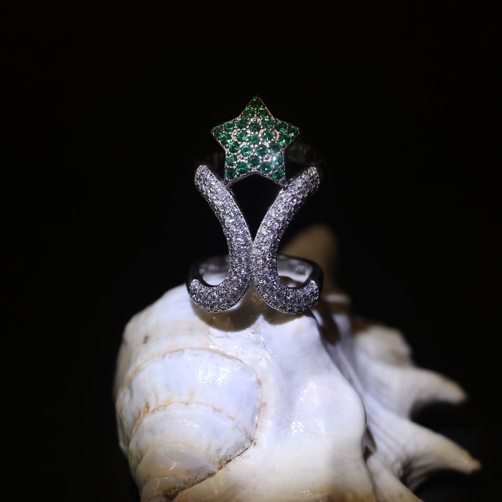 SILVER RING WITH ZIRCON STUDDED CURVES AND A GREEN GEMSTONE