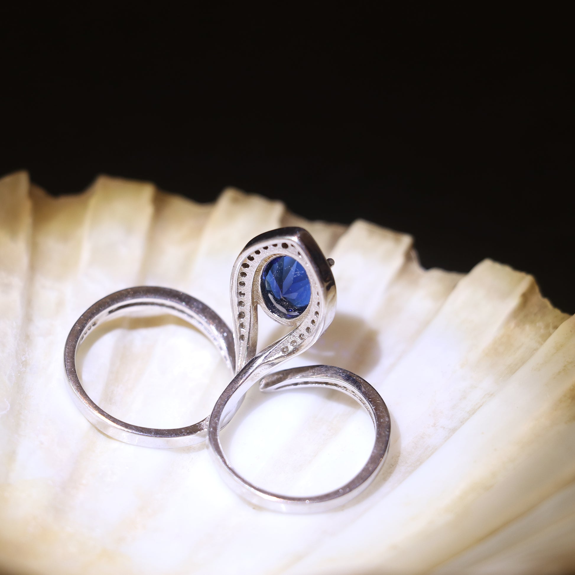 SILVER RING WITH TEARDROP HALO AND BLUE STONE