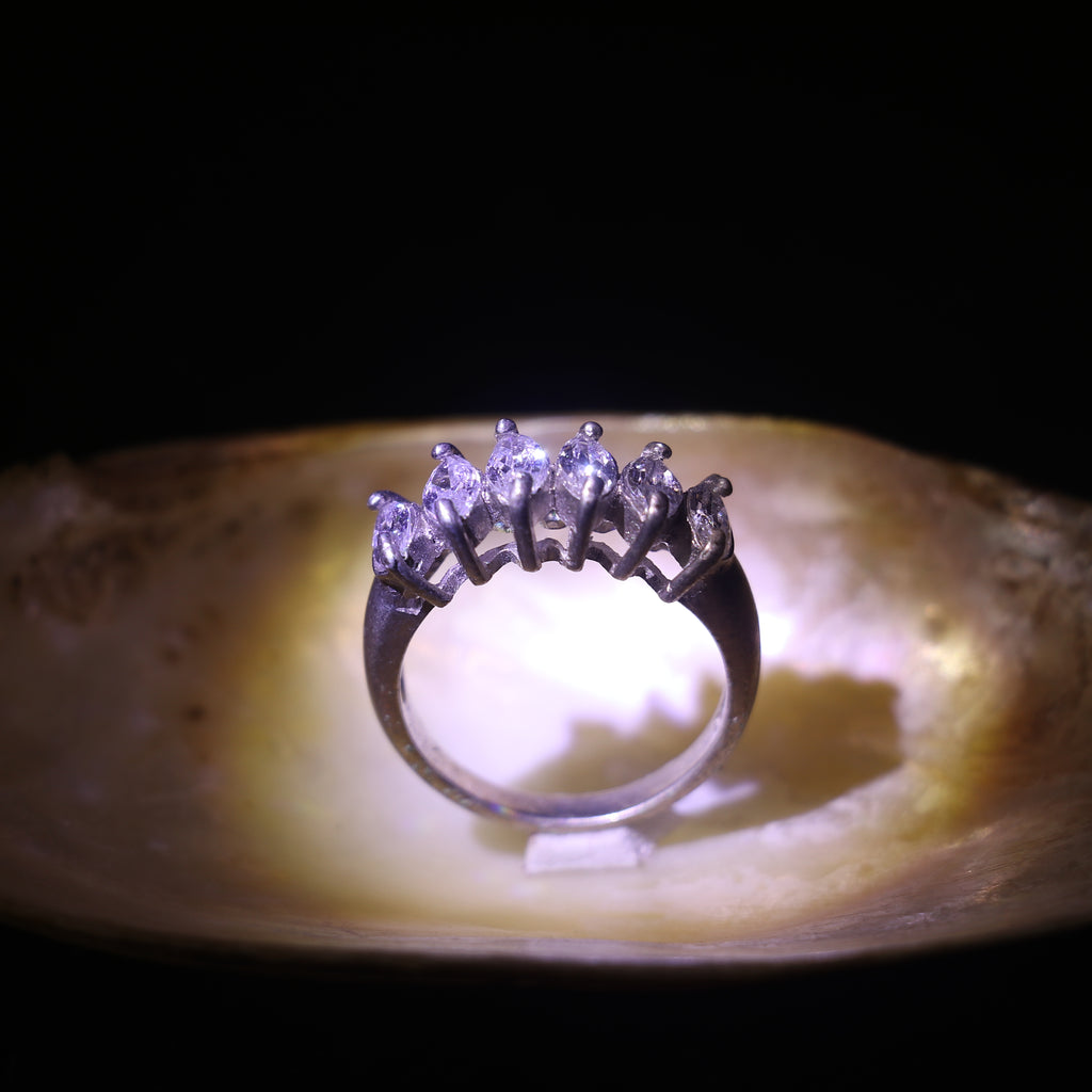 SILVER RING WITH A ROW OF MARQUISE CUT ZIRCONS
