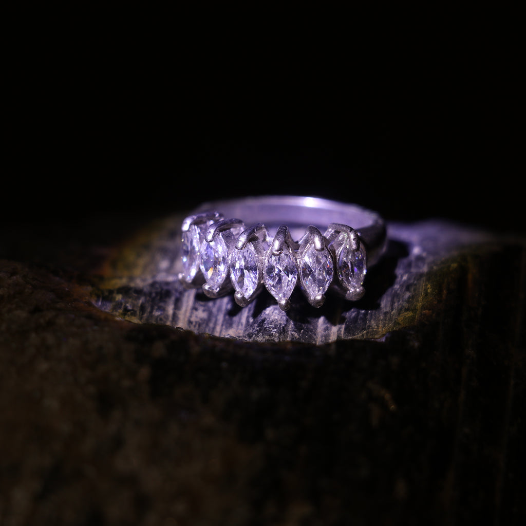 SILVER RING WITH A ROW OF MARQUISE CUT ZIRCONS