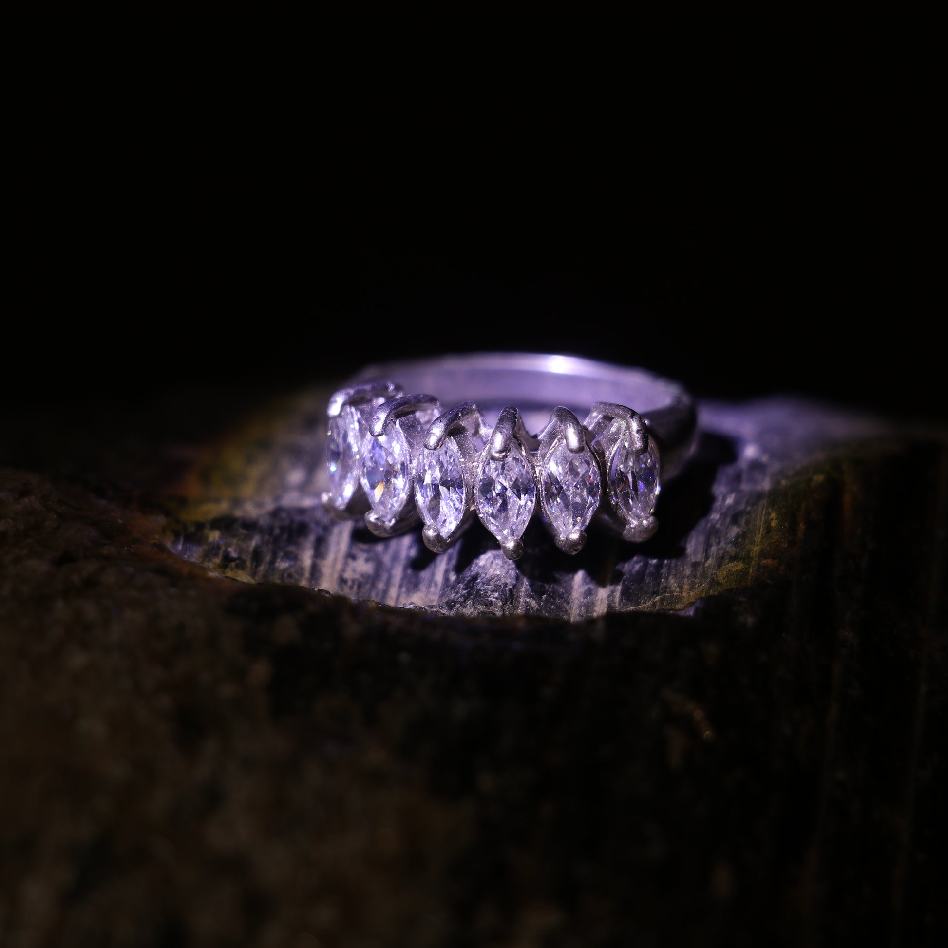 SILVER RING WITH A ROW OF MARQUISE CUT ZIRCONS