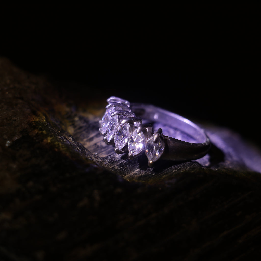 SILVER RING WITH A ROW OF MARQUISE CUT ZIRCONS