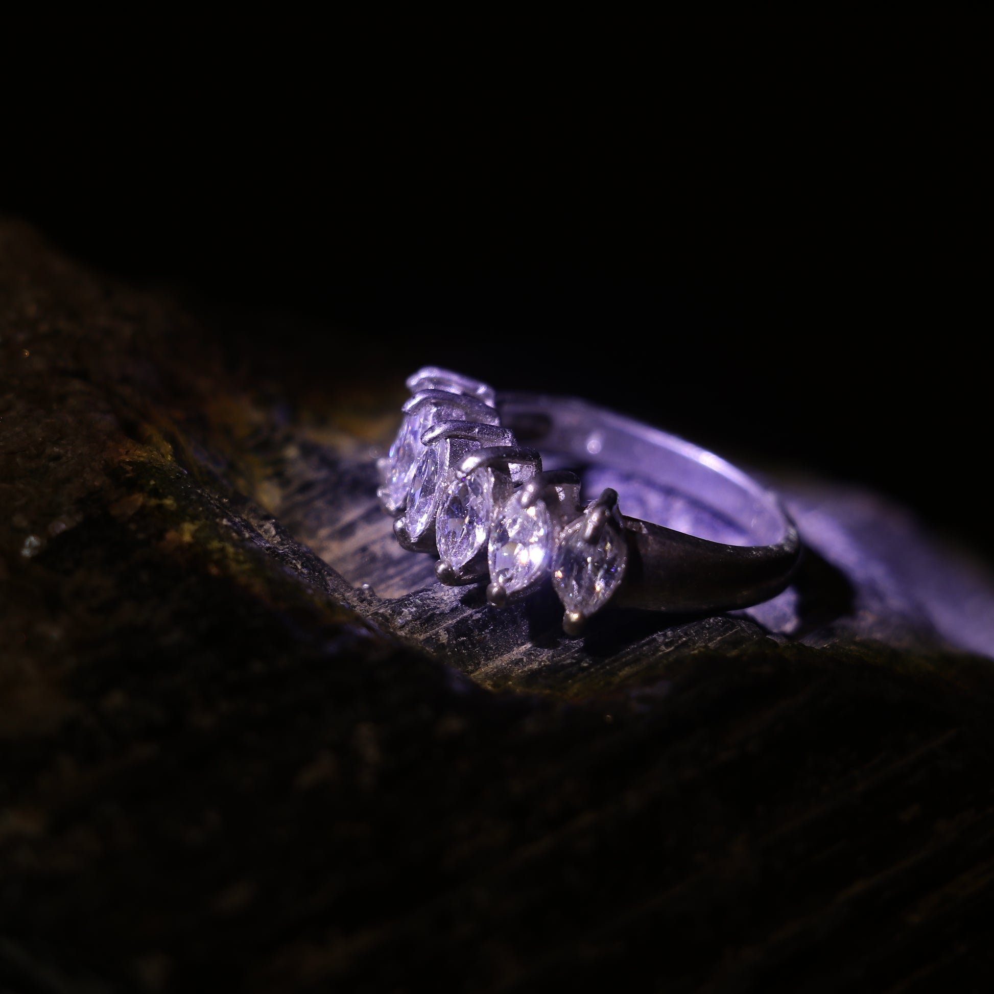 SILVER RING WITH A ROW OF MARQUISE CUT ZIRCONS
