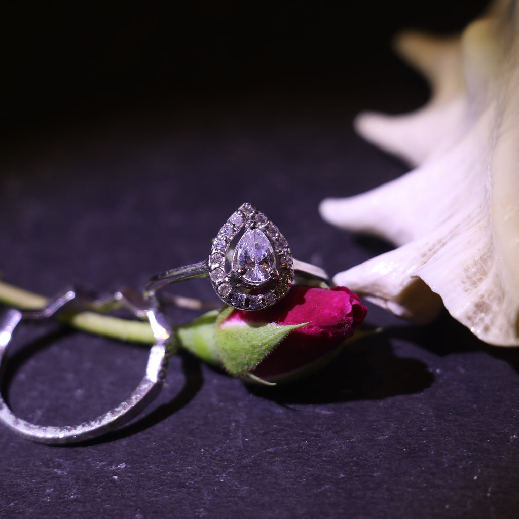 TEARDROP SHAPED ZIRCON RING WITH HALO SETTING