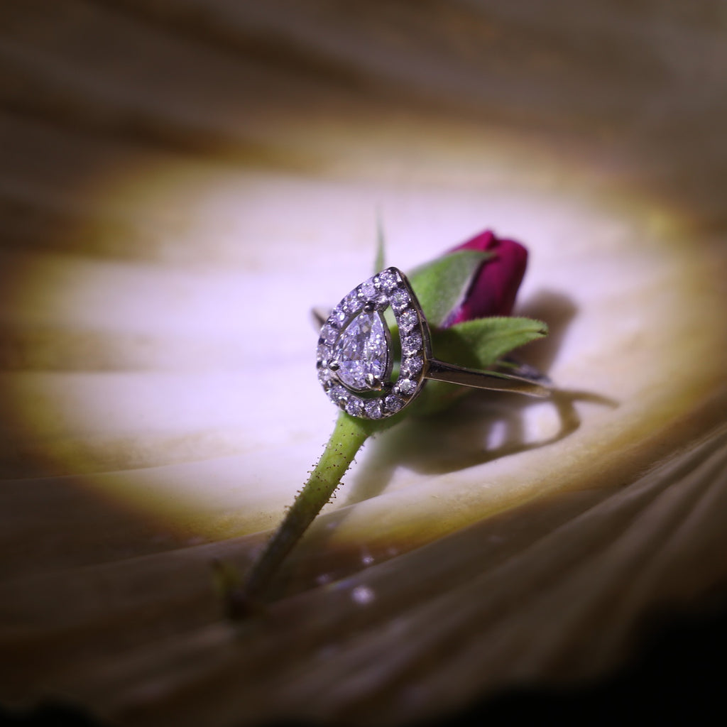 TEARDROP SHAPED ZIRCON RING WITH HALO SETTING