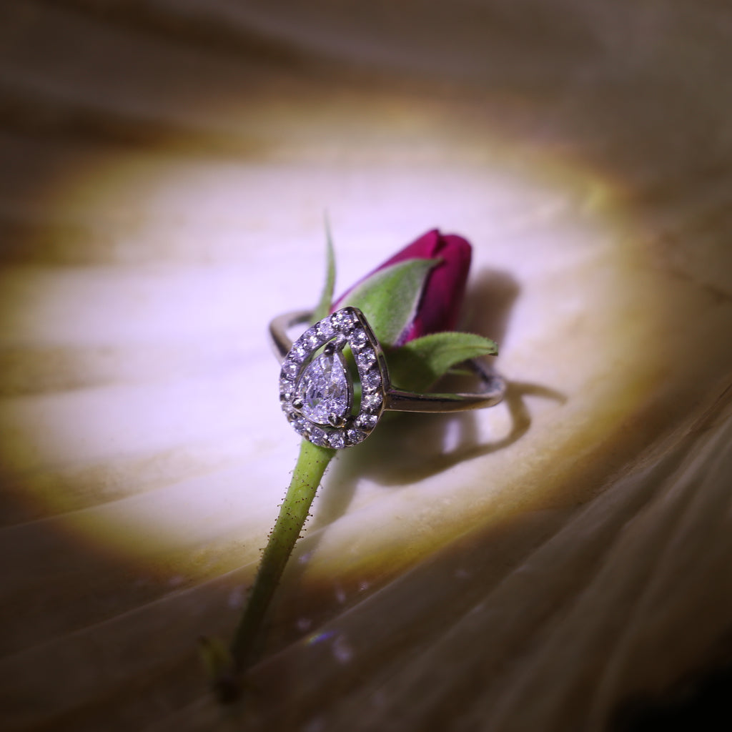 TEARDROP SHAPED ZIRCON RING WITH HALO SETTING