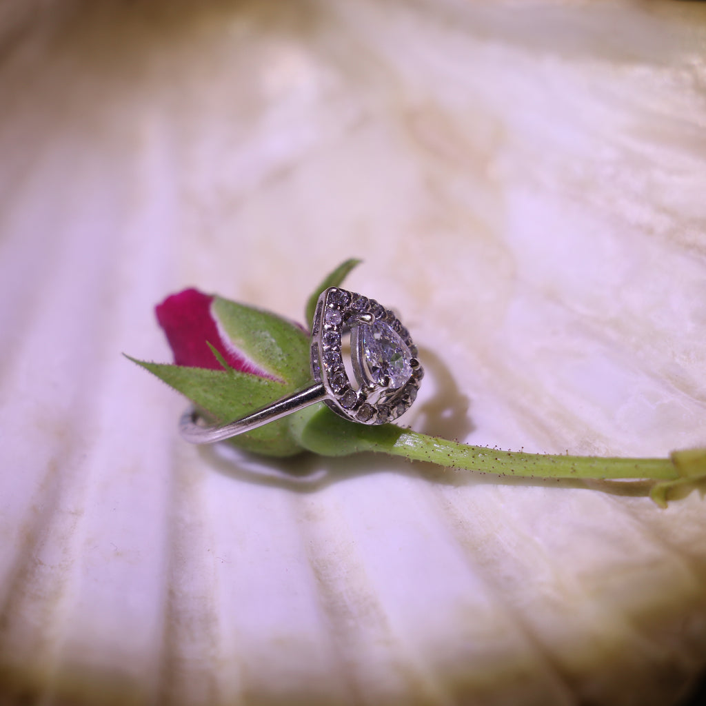 TEARDROP SHAPED ZIRCON RING WITH HALO SETTING