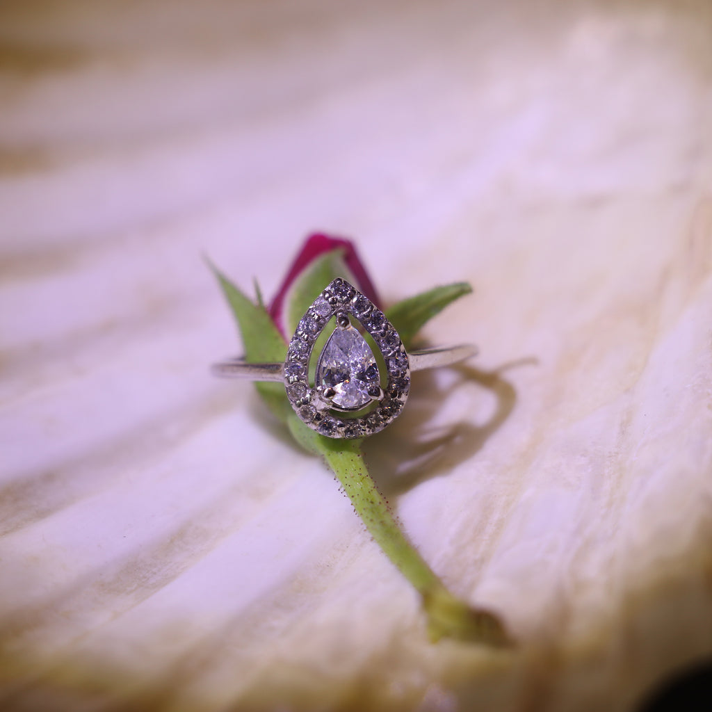 TEARDROP SHAPED ZIRCON RING WITH HALO SETTING