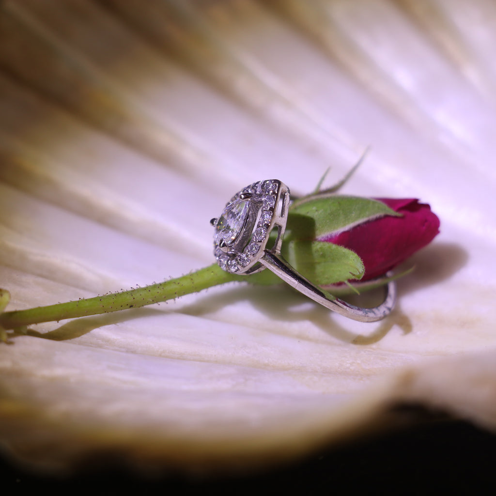 TEARDROP SHAPED ZIRCON RING WITH HALO SETTING