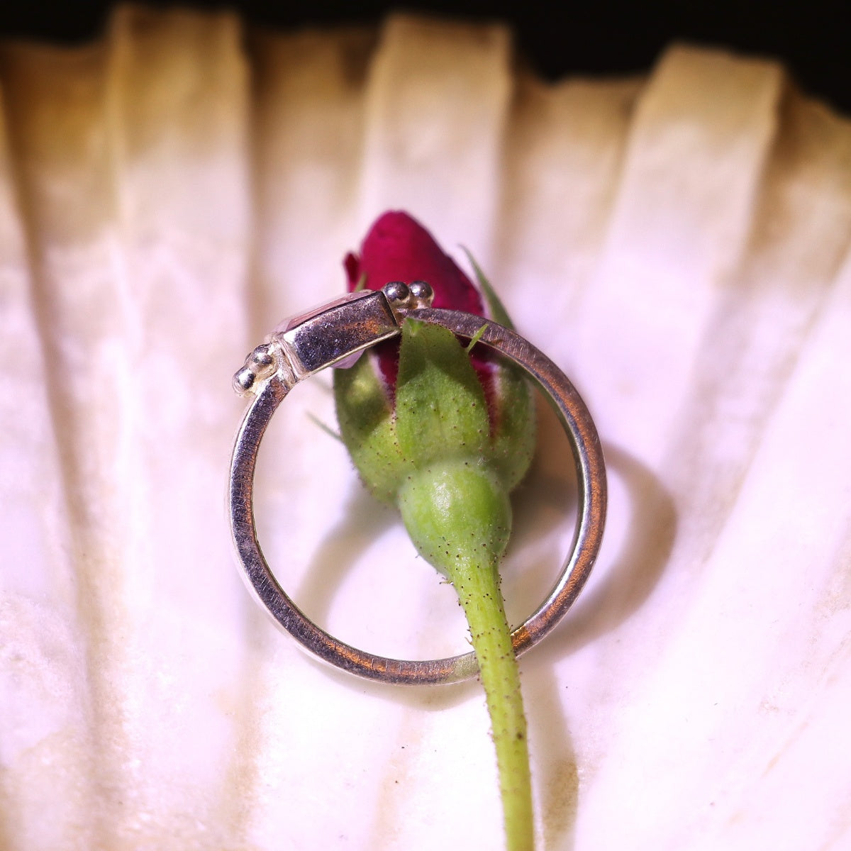 Silver ring adorned with a bold square-cut pink gemstone