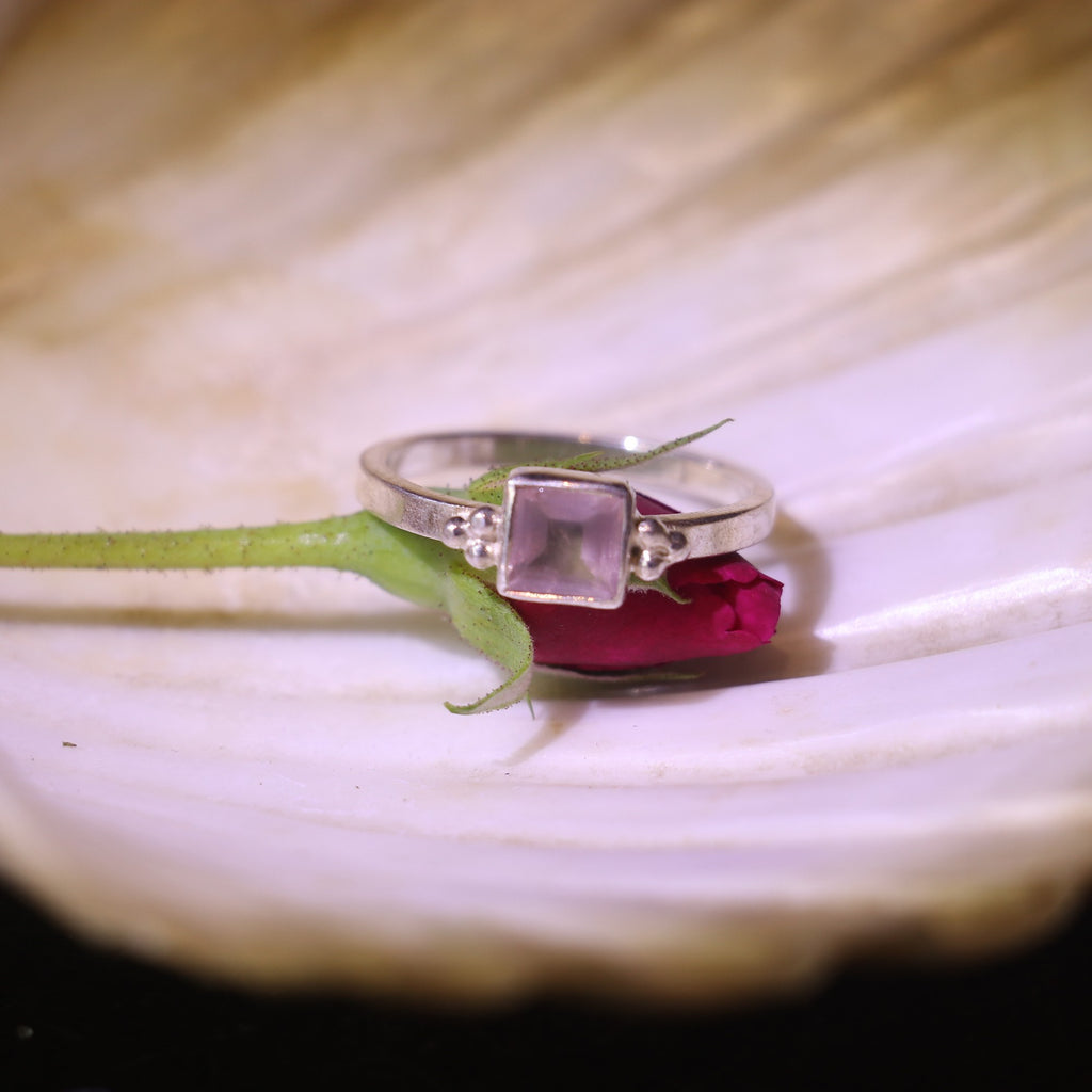 SILVER RING ADORNED WITH A BOLD SQUARE CUT PINK GEMSTONE