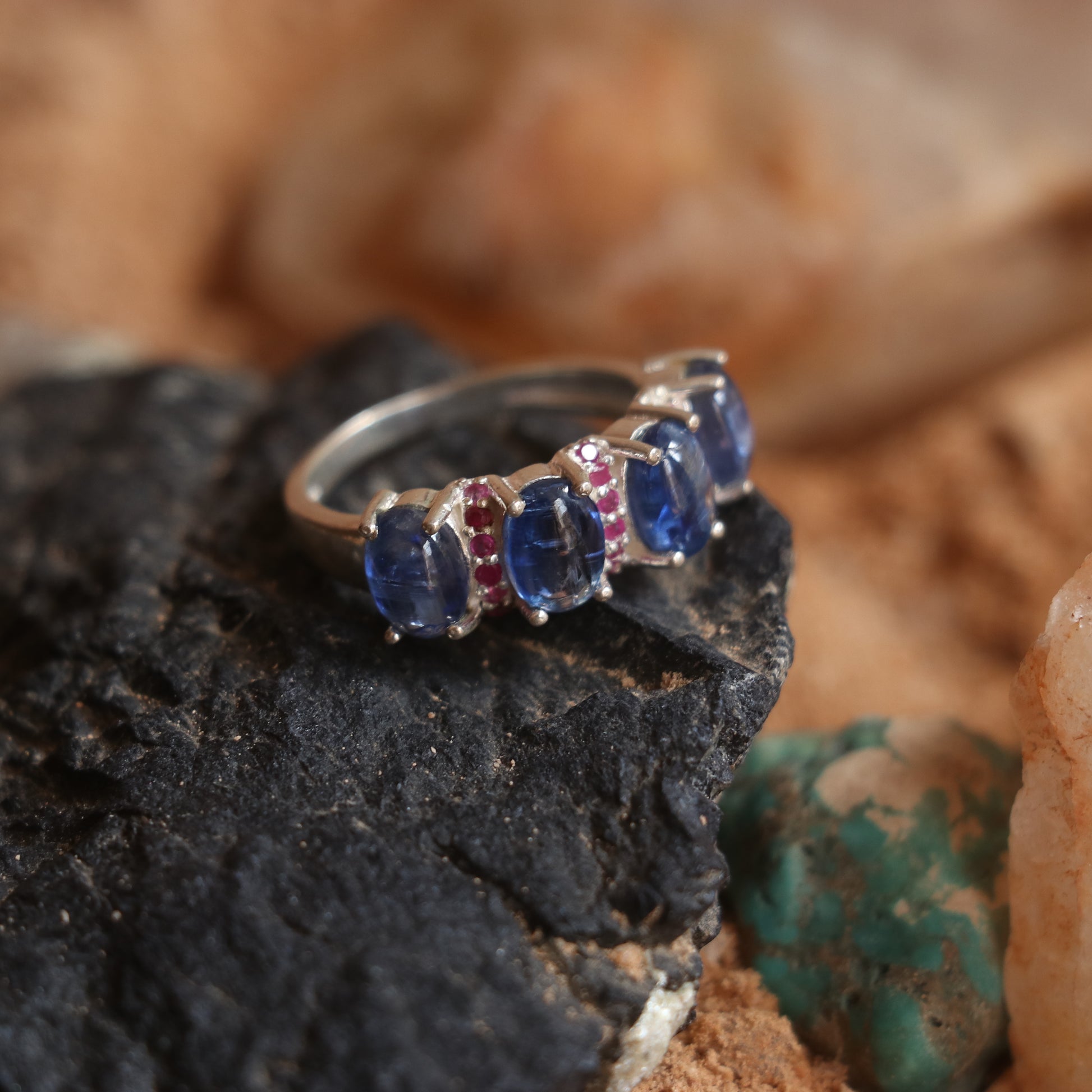 SILVER RING STUDDED WITH RUBIES AND TANZANITE
