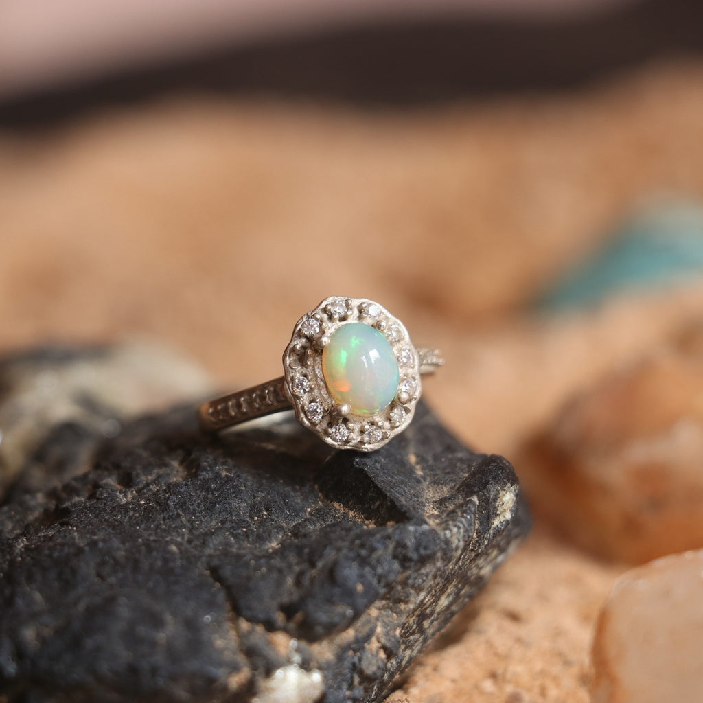 SILVER RING STUDDED WITH ZIRCON AND NATURAL ETHIOPIAN OPAL