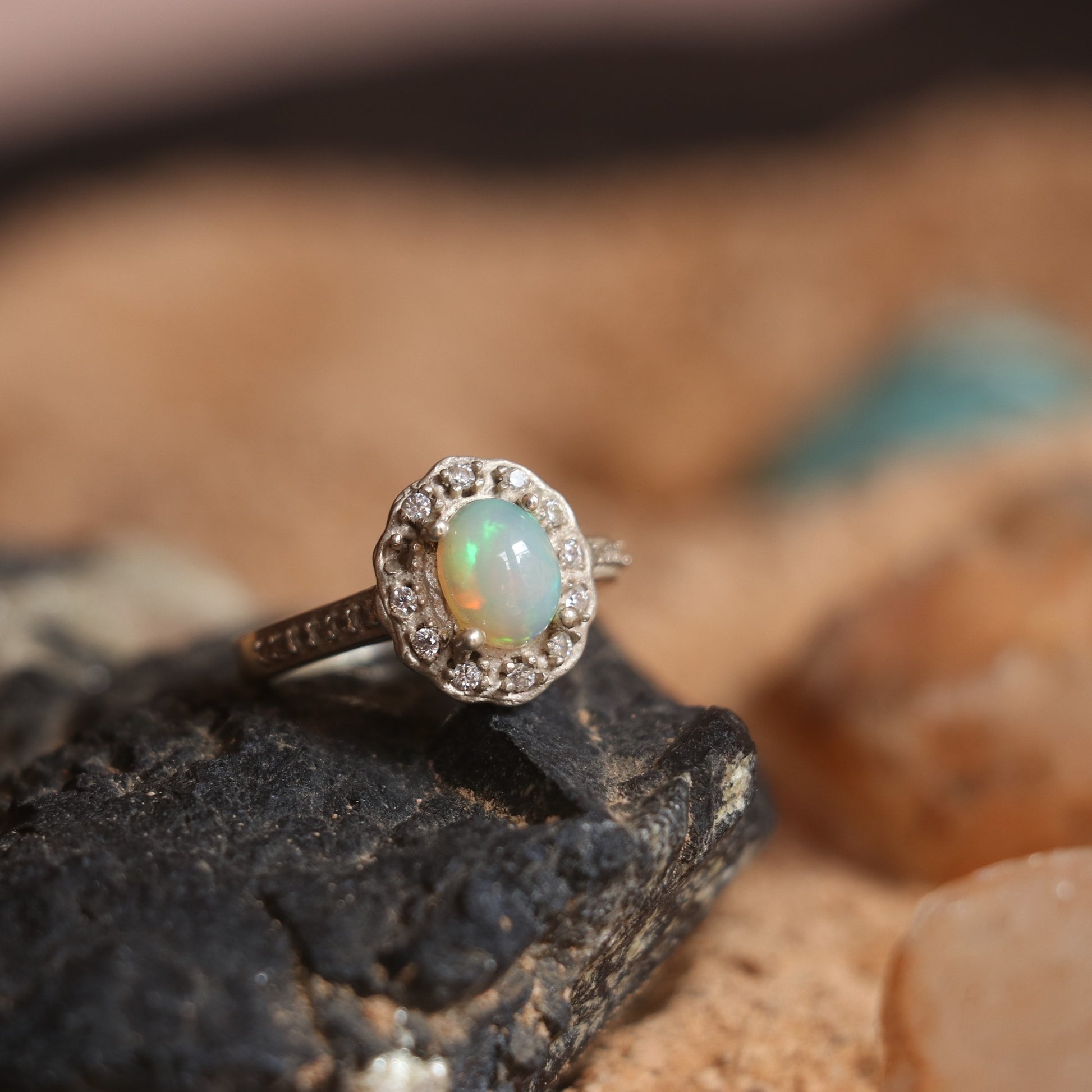 SILVER RING STUDDED WITH ZIRCON AND NATURAL ETHIOPIAN OPAL