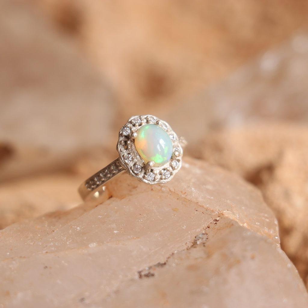 SILVER RING STUDDED WITH ZIRCON AND NATURAL ETHIOPIAN OPAL