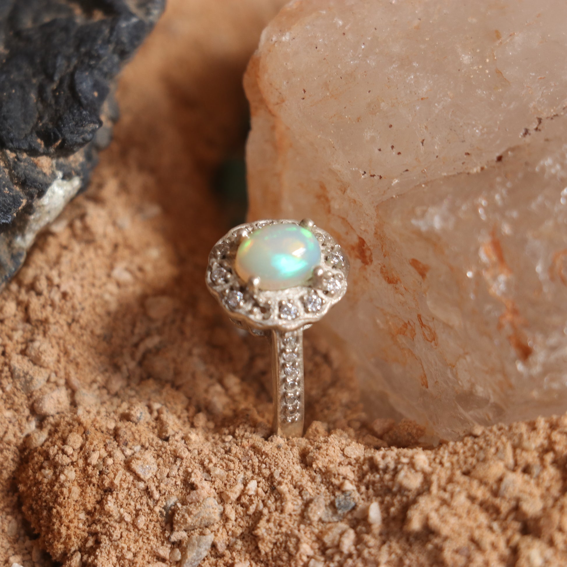 SILVER RING STUDDED WITH ZIRCON AND NATURAL ETHIOPIAN OPAL