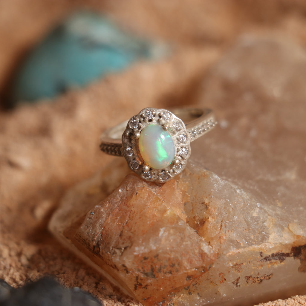 SILVER RING STUDDED WITH ZIRCON AND NATURAL ETHIOPIAN OPAL