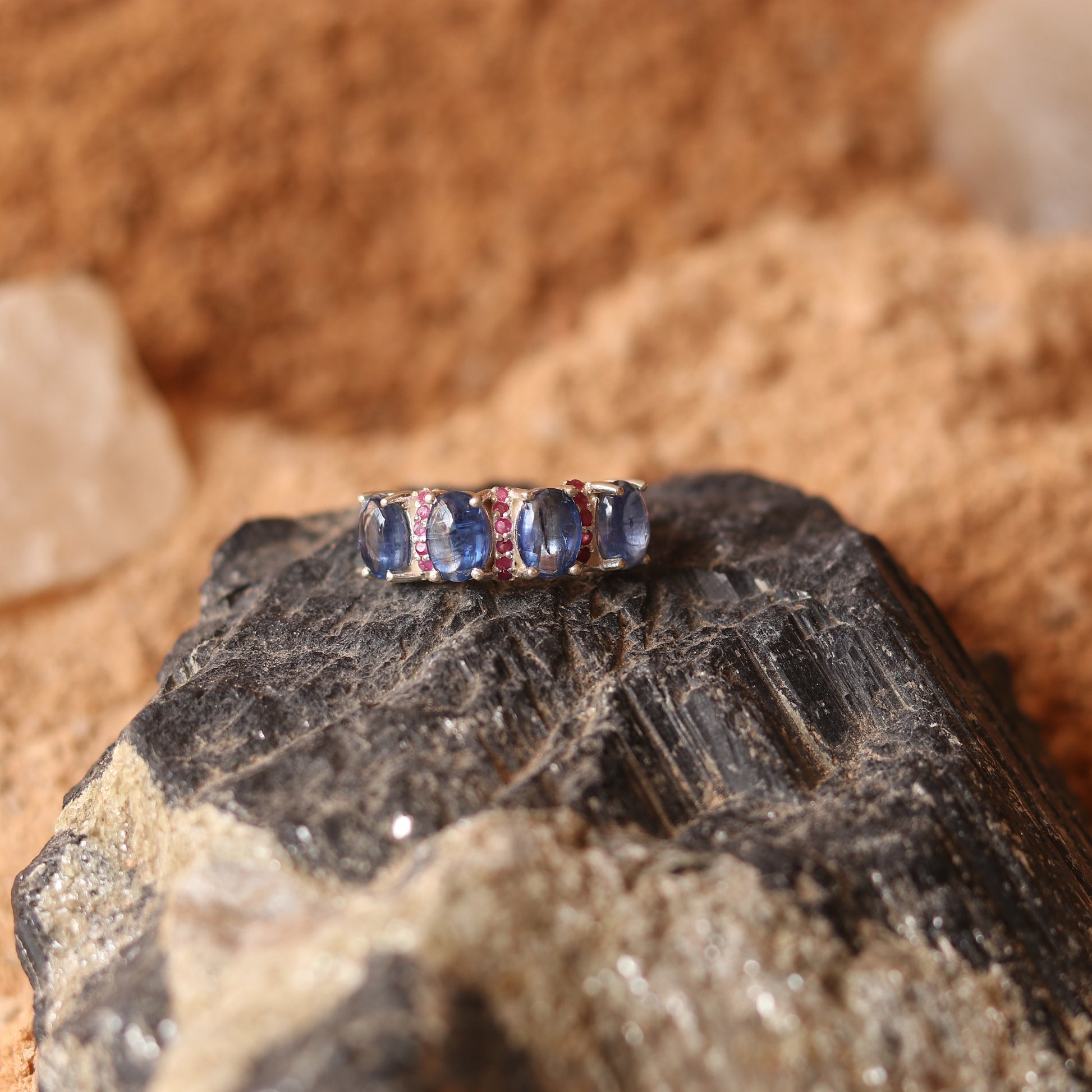 SILVER RING STUDDED WITH RUBIES AND TANZANITE